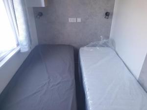 Campings Mobil-home 2023 RapidHome Panorama 3 chambres 6 velos lave-vaisselle 2 piscines couvertes : photos des chambres