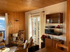 Chalets Chalet avec sauna et vue sur le lac : photos des chambres