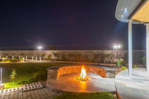 StayVistas Le Ciel - Lakeside Retreat Amidst Farmland with Pool, Indoor Activities, Lawn, Bonfire Pit & Ample Seating Space