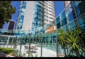 Quarto em condomínio beira-mar