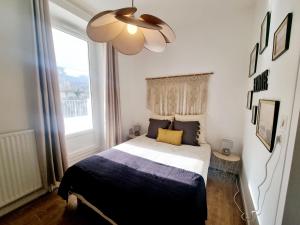 Appartements Grand T3 rue pietonne bureau et terrasse : photos des chambres