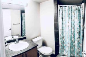 2 BDRM AC Condo wEnsuite Laundry + Free Parking