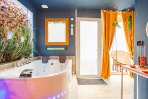 Appartements Appartement hammam & jacuzzi : photos des chambres