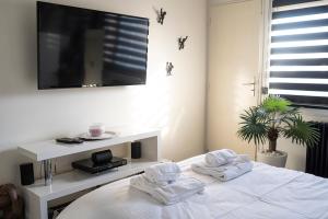 Appartements L’instant Cosy by GiMi : photos des chambres