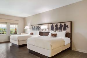 Suite with Two Queen Beds and Balcony room in Best Western Bandera Suites & Saloon