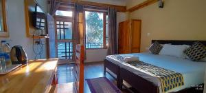 Tirthan Grand Riverside