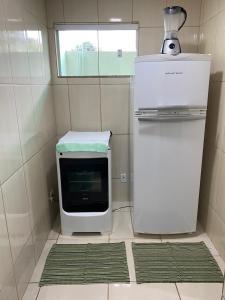 Casa aconchegante e charmosa à 6 min da Praia - Ar condicionado - WIFI 600MB - Netflix - Globoplay - Cozinha Completa