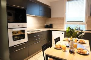 Appartements M.A.H 2 Le calme en hyper centre magnifique : photos des chambres