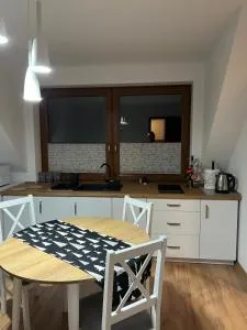 Pokój z aneksem kuchennym - Rychwałd