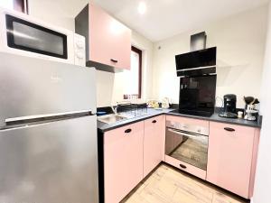 Appartements L'odyssee, a 5 min de la gare ~ Fibre + parking : photos des chambres