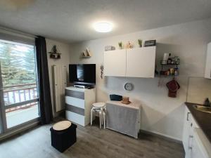 Appartements Studio 2 alpes, lumineux plein ouest, balcon, parking : photos des chambres