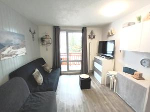 Appartements Studio 2 alpes, lumineux plein ouest, balcon, parking : photos des chambres