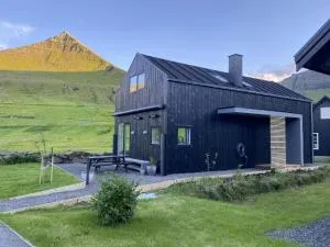 Luxury Cottage with Stunning Views - Okkara summarhús við Gjógv - جوجي