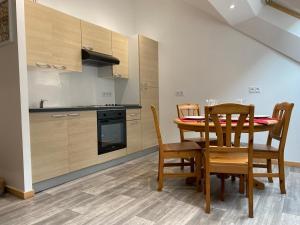 Appartements Le cosy de la vologne : photos des chambres