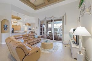 Beachy west exposure waterfront home with pool and spa