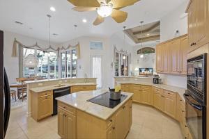 Beachy west exposure waterfront home with pool and spa