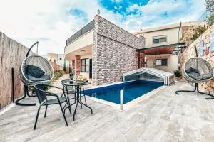 Anil's house - מתחם צימרים עם בריכה מקורה ומחוממת Zimmer with heated swimming pool - 艾因霍德