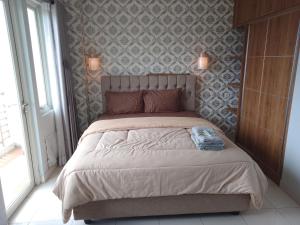 AR Putra at Sentul Tower Apartment by Rindu