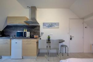 Appartements La petite maison 3 : photos des chambres