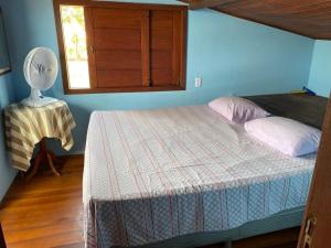 Casa com piscina e um quarto com ar split pé na areia a 50 metros da praia