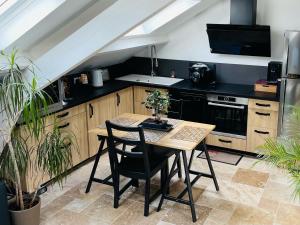 Appartements Studio sous combles avec prestation haut de gamme : photos des chambres