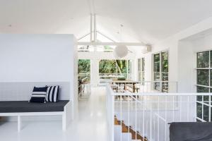 The Beach House is stylish and private pool and tennis court