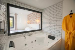 Appartements Le Maleville - Balneo & Ascenseur : photos des chambres