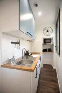 Appartements Le Maleville - Balneo & Ascenseur : photos des chambres