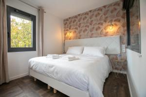 Appartements Le Maleville - Balneo & Ascenseur : photos des chambres