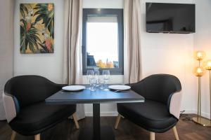 Appartements Le Maleville - Balneo & Ascenseur : photos des chambres