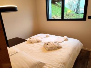 Chalets Chalet Lignum, Exceptionel - Sauna & SPA - vue sur les montagnes, 8 minutes des pistes. : photos des chambres