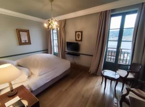 Hotels Le Manoir Au Lac : photos des chambres