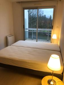 Appartements T2 pres des commerces et Thermes literie neuve Parking prive wifi : photos des chambres