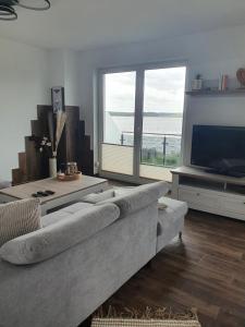 Moderne Ferienwohnung mit Balkon direkt an der Peene