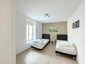 Appartements Au Fil De L'eau - Les Remparts : photos des chambres