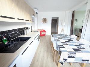 Appartements La Clematite, gite climatise 3 couchages independants : photos des chambres