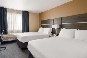 Queen Room with Two Queen Beds - Non-Smoking room in Rest Inn Suites Motel