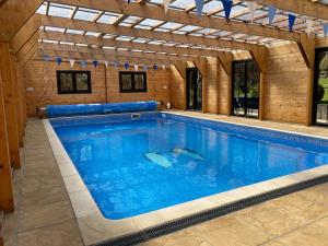 Monktonmead Lodge in secluded setting, with private indoor pool.