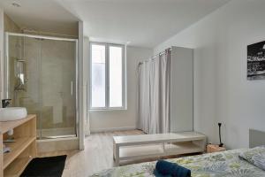 Appartements L'ESCALE -Climatisation- Proche CENTRALE TRICASTIN - WIFI - NETFLIX - Parking GRATUIT : photos des chambres