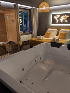 Appartements La Suite - Spa & Sauna : photos des chambres