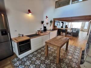 Ancien magasin type loft 145 m2 centre ville