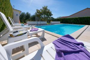 VILLA LIVIA with three nice apartments, swimming pool, childrens playground, barbecue and free parking