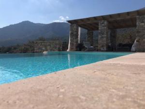 Villas Maison en pierre proche des Gorges de l'Asco entre mer montagne et piscine : photos des chambres