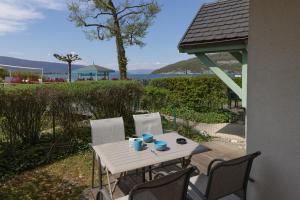 Appartements Studio les Pieds dans L'eau au bord du lac d'Annecy : photos des chambres