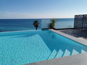 Appartements Pearl Beach - Rooftop Pool Seaside : photos des chambres