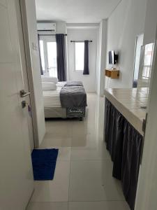 Apartment Grand Sentraland Karawang Manage by Laguna Room