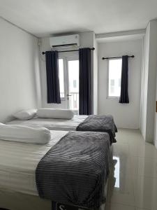 Apartment Grand Sentraland Karawang Manage by Laguna Room