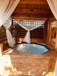 Chalets Chalet bois jacuzzi : photos des chambres