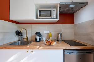 Appartements Les Maisons Acajou : photos des chambres