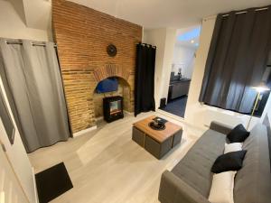 Appartements Au P'tit Loft - Wifi fibre - Orange TV - Hyper Centre - Gare : photos des chambres